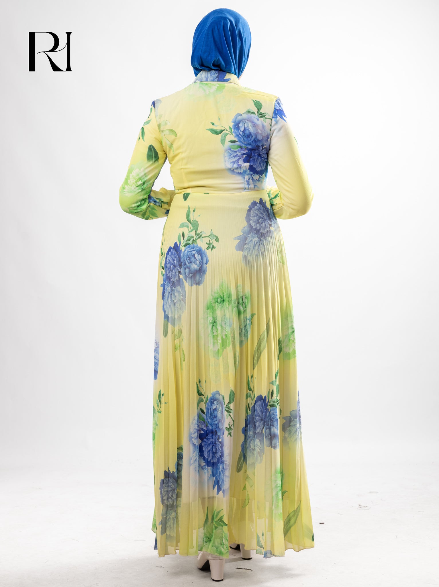 Yellow floral dress with a blue hijab on a white background