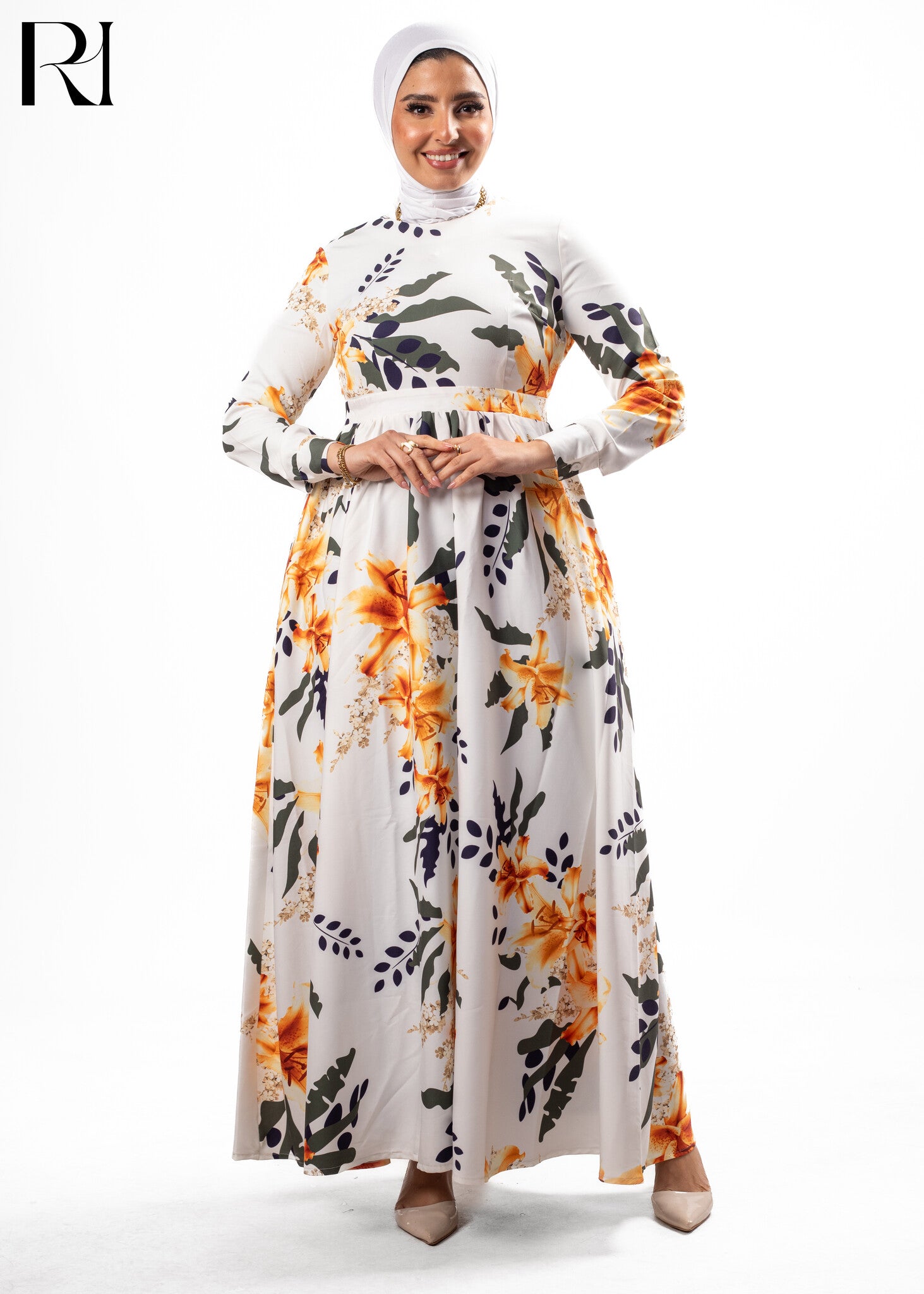 Woman wearing a floral dress with a hijab on a white background