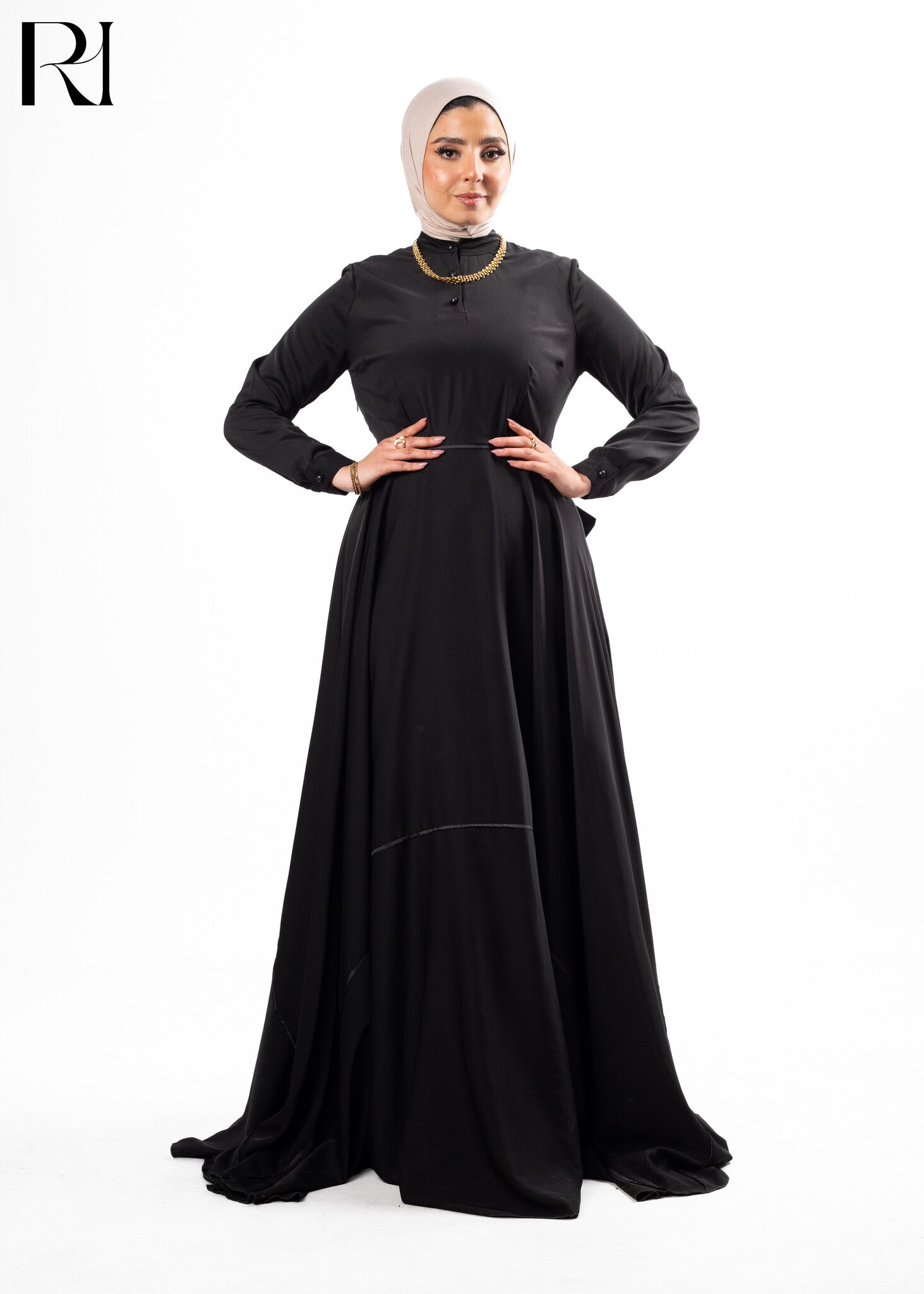 Woman wearing a black abaya with a hijab-ruehaya
