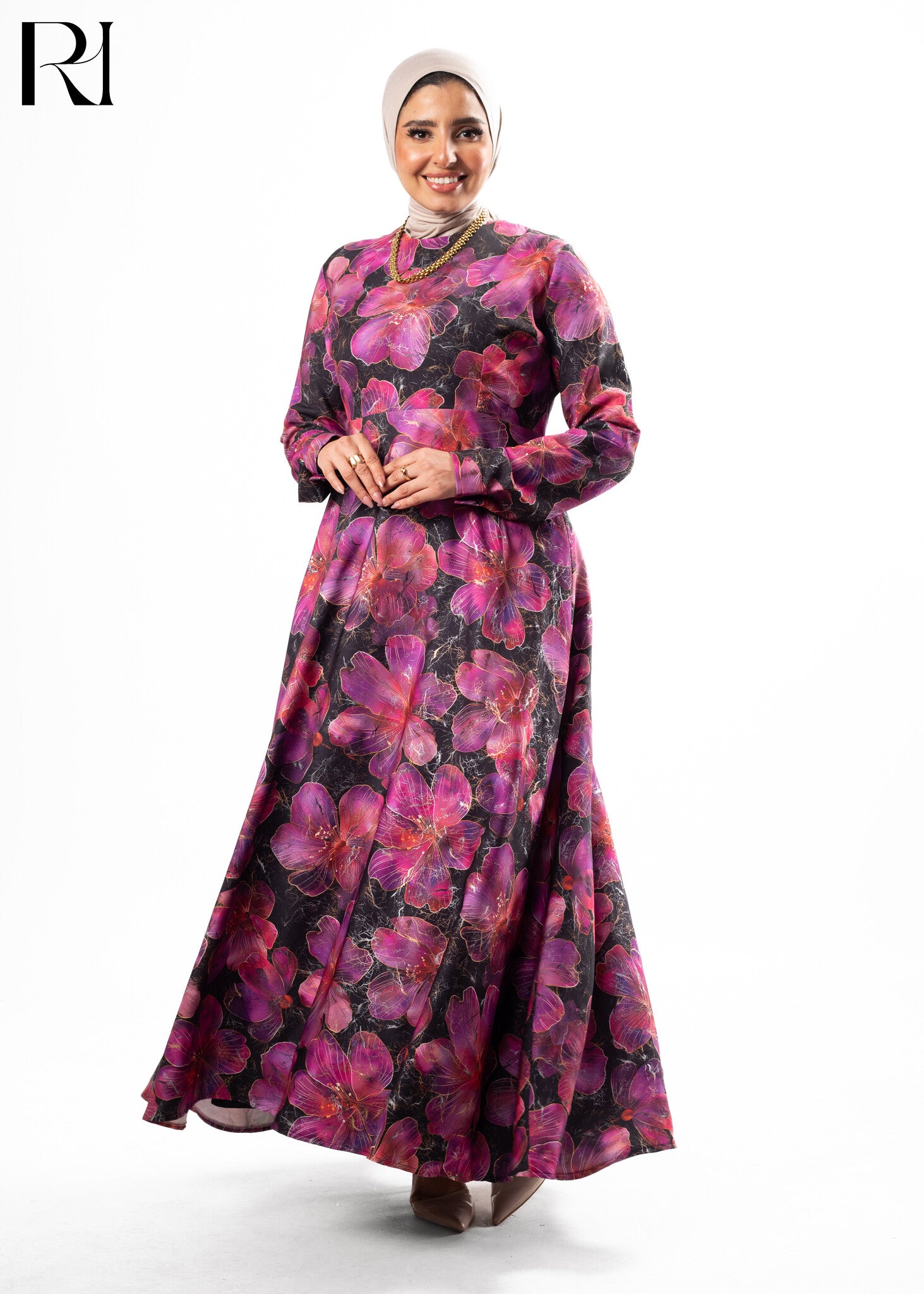 Woman wearing a floral dress with a hijab on a white background