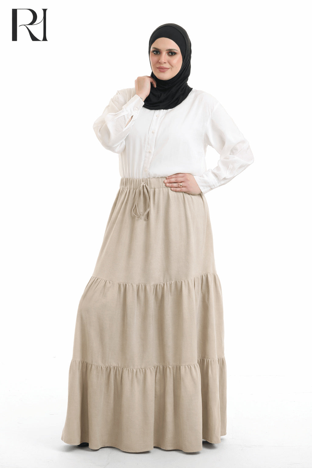 Woman wearing a white blouse and beige skirt with a hijab on a white background
