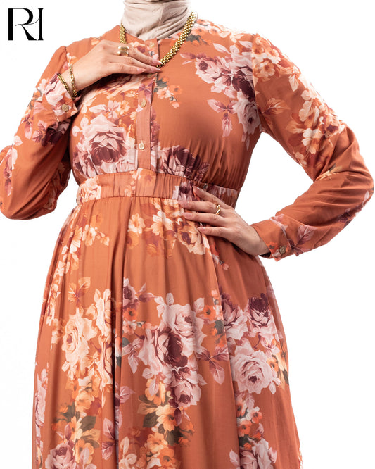 Orange floral dress with long sleeves on a white background
