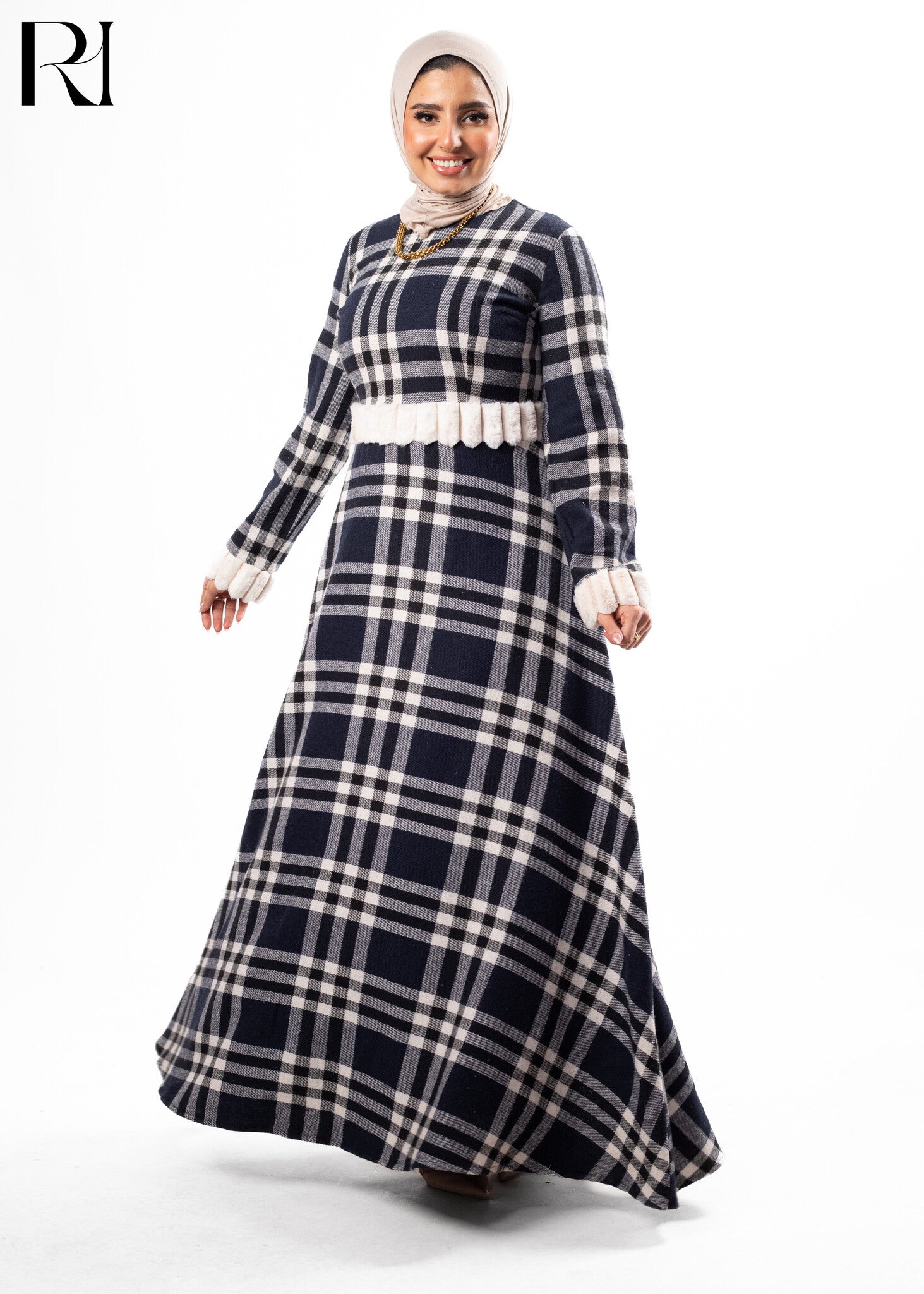 Woman wearing a black and white checkered dress-ruehaya