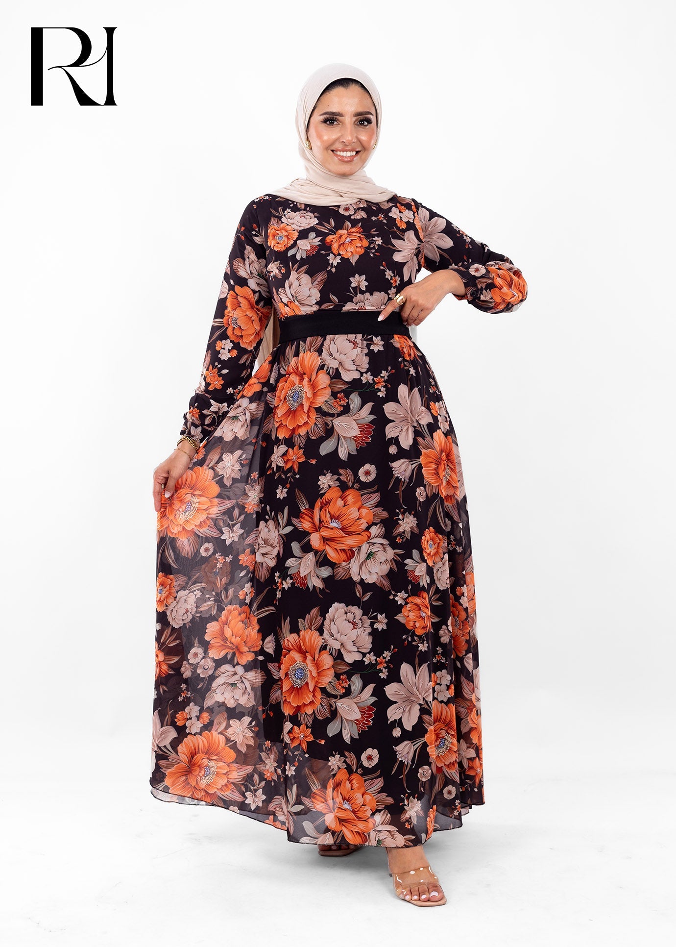 Woman wearing a floral dress with a hijab on a white background