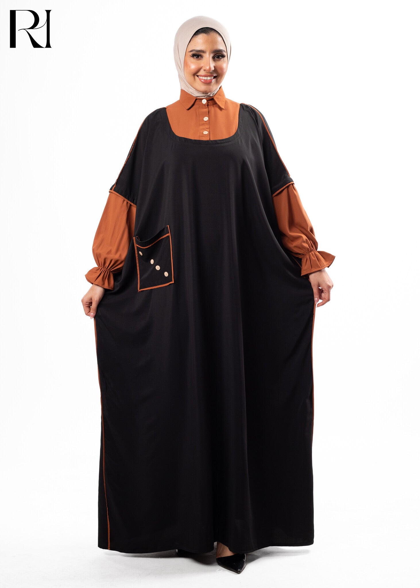 Woman wearing a black and brown dress with a hijab-ruehaya