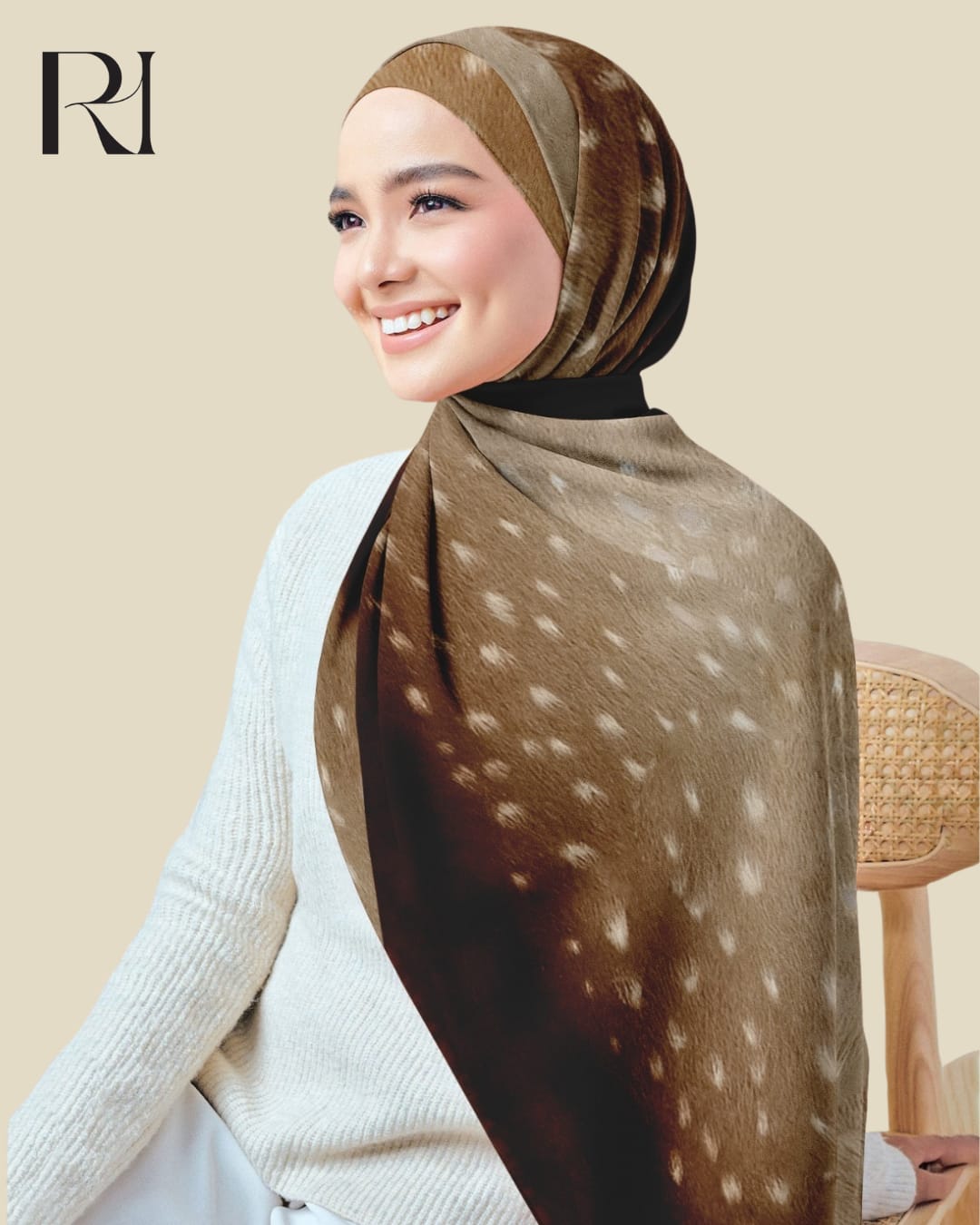Woman wearing a patterned hijab with a visible brand logo on a beige background