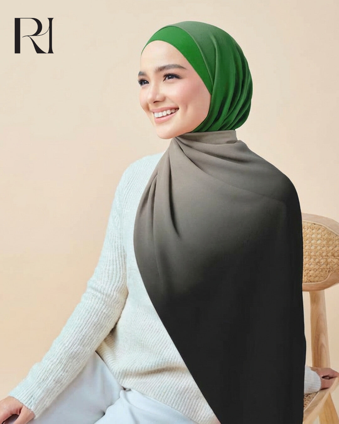 Woman wearing a green hijab and gray shawl against a beige background with 'RH' logo.