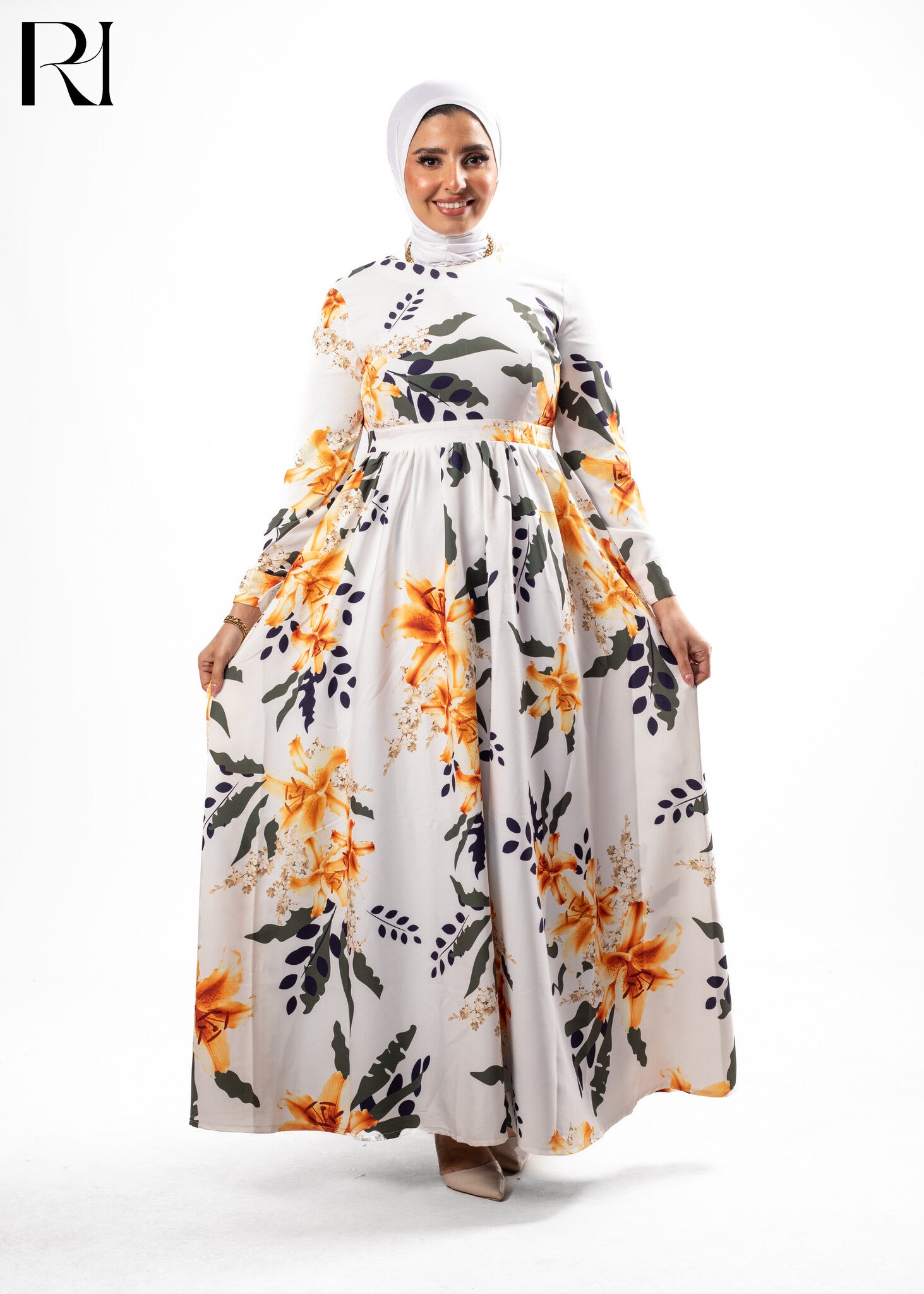 Woman wearing a floral dress with a hijab on a white background