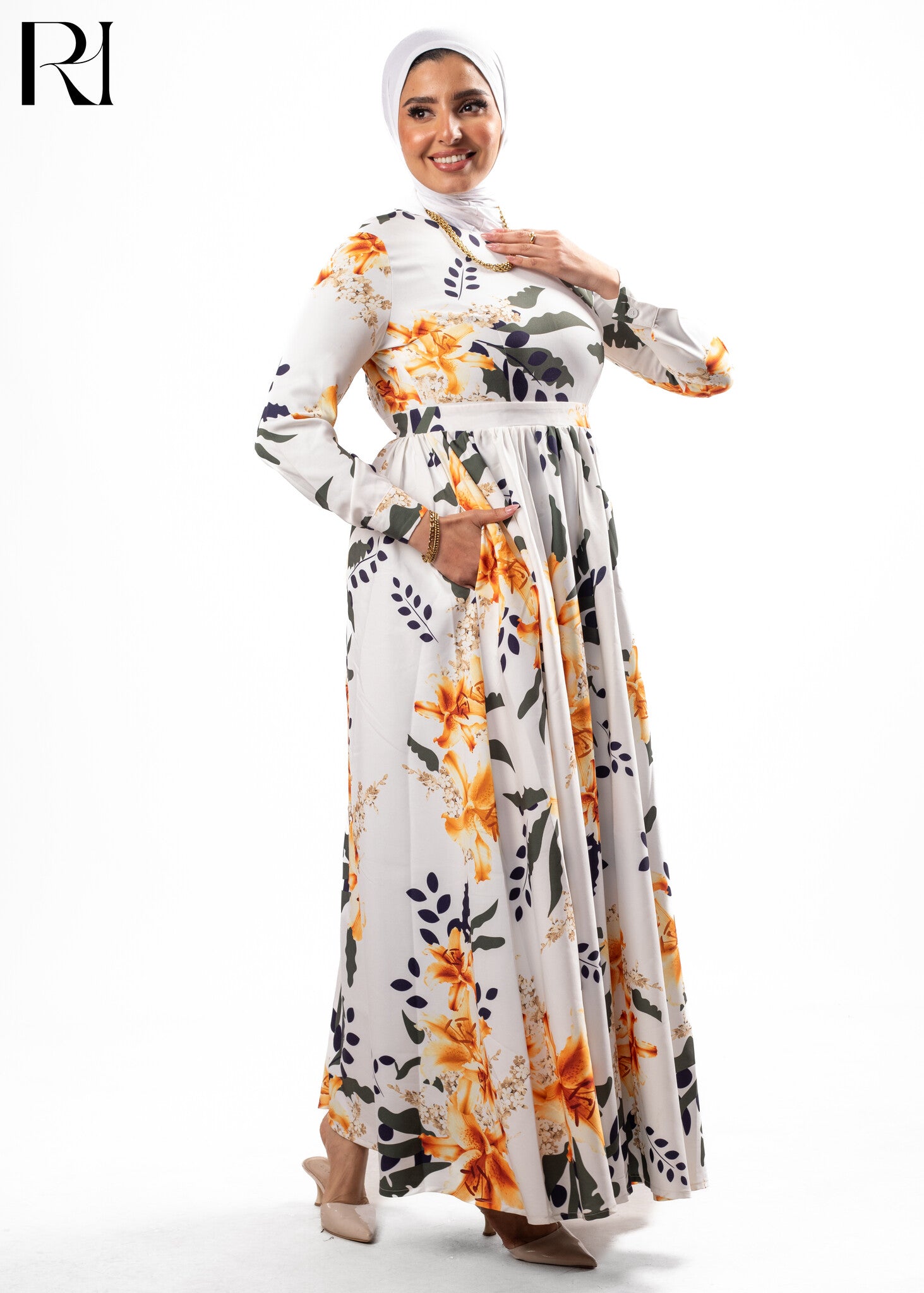 Woman wearing a floral dress with a hijab on a white background