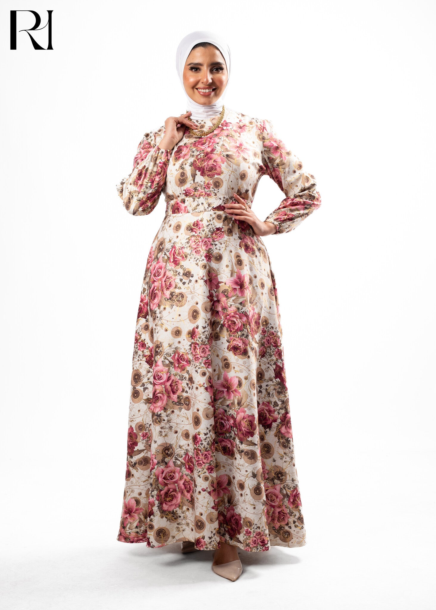 Woman wearing a floral dress with a white hijab on a white background