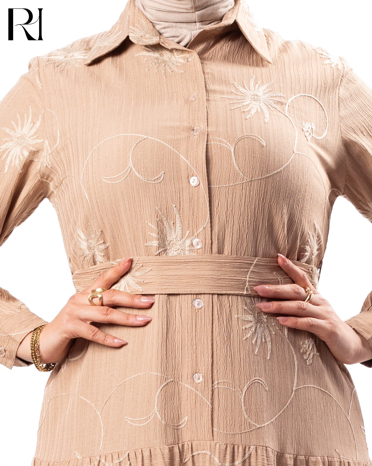 Beige dress with floral embroidery and a belt, featuring the brand logo.