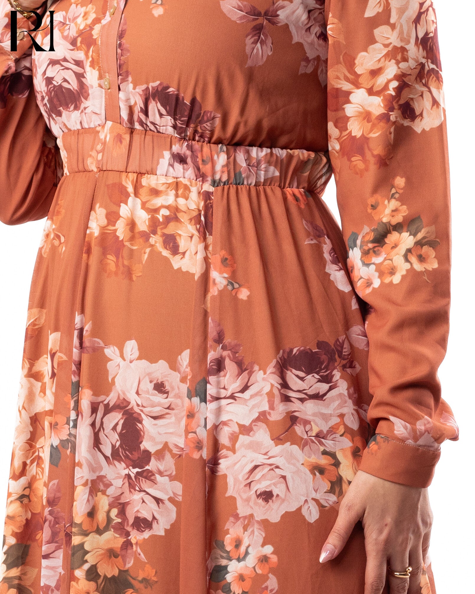 Orange floral dress with long sleeves on a white background
