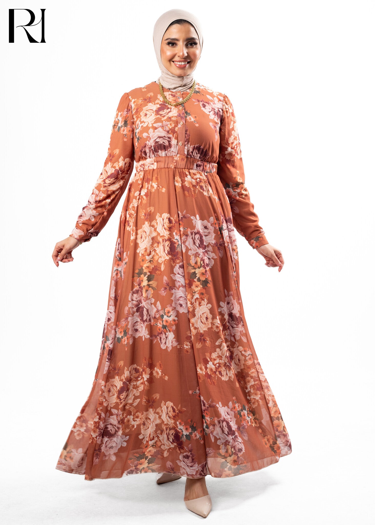 Woman wearing a floral dress with a hijab on a white background
