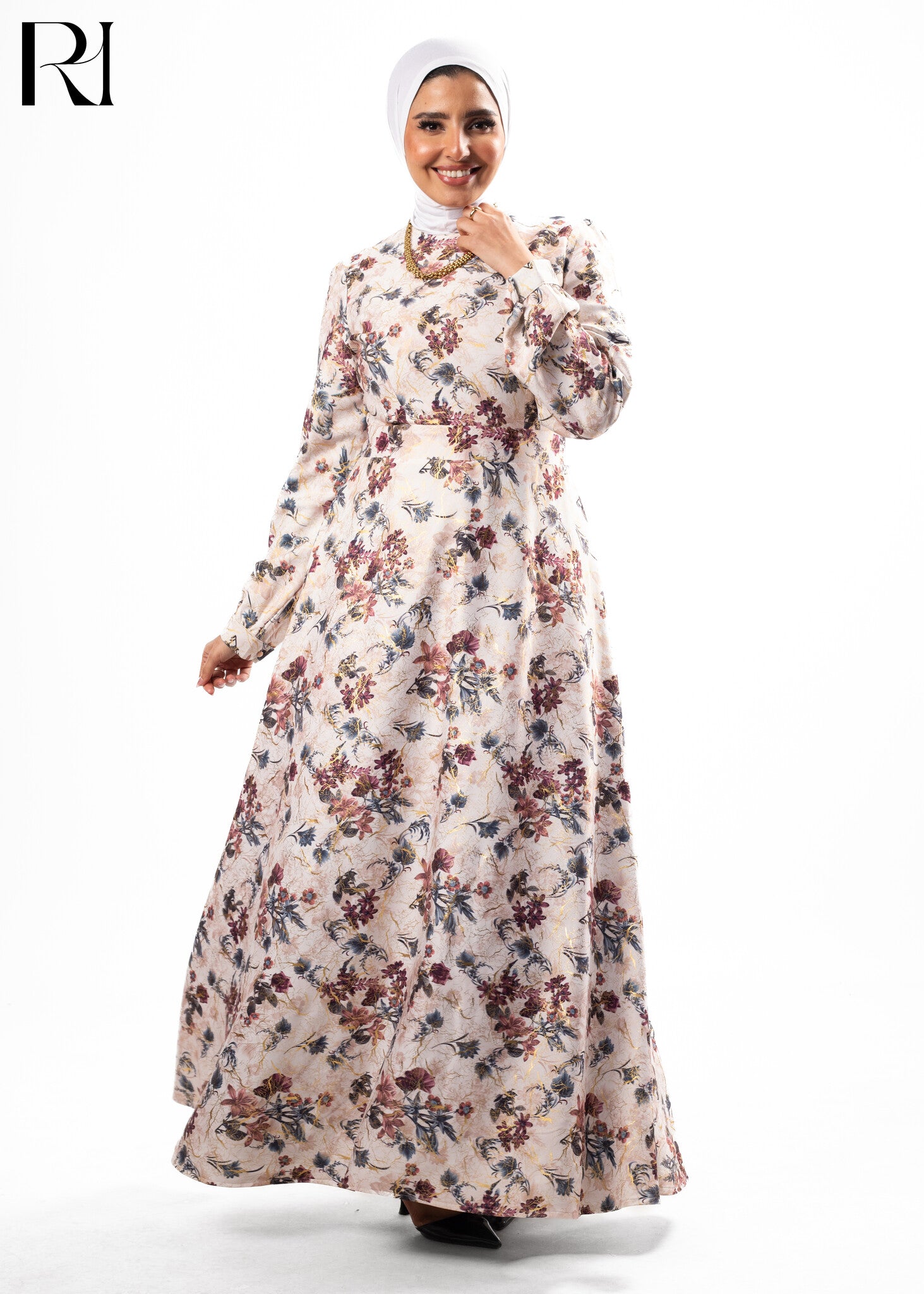Woman wearing a floral dress with a hijab on a white background