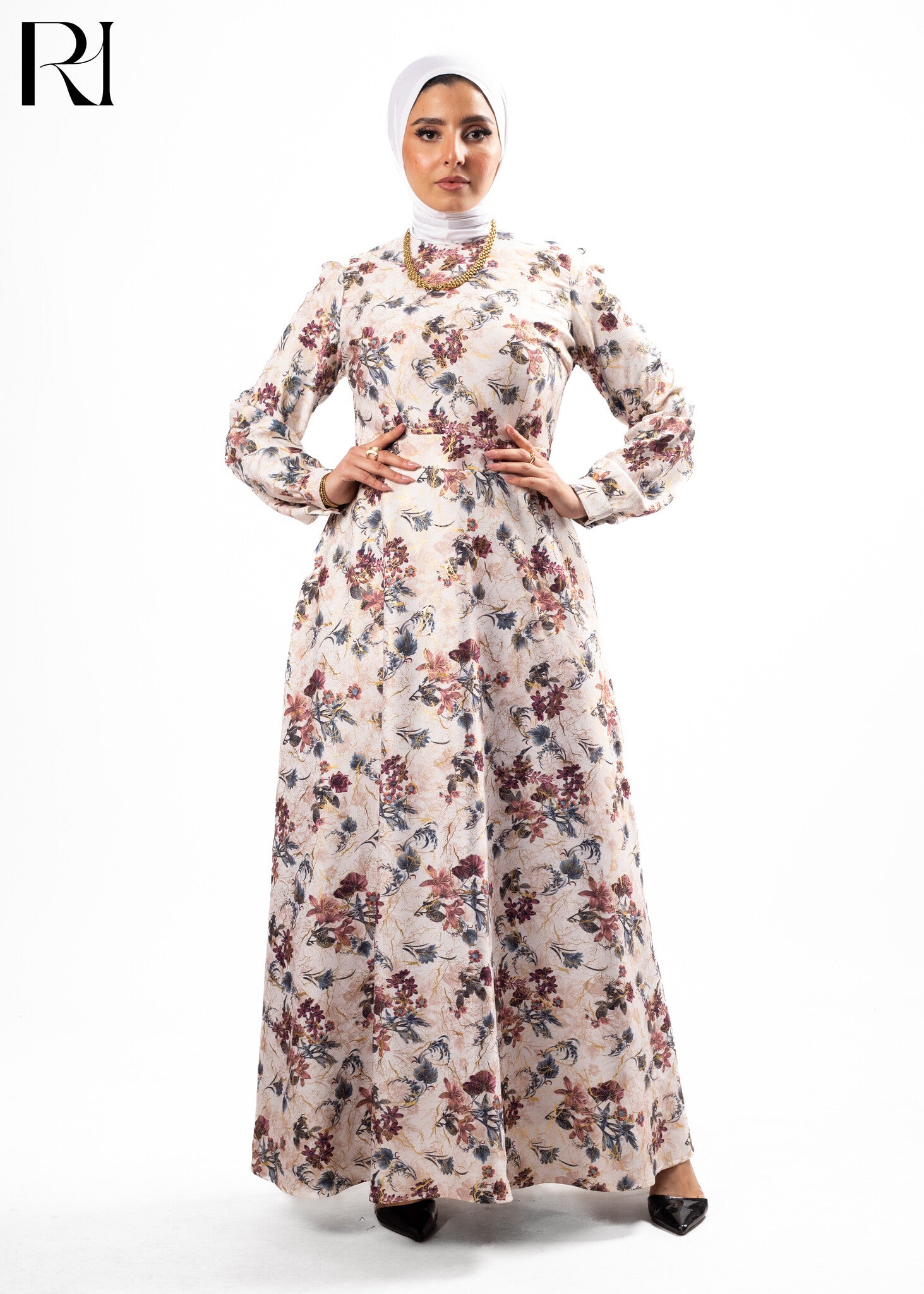 Woman wearing a floral dress with a hijab on a white background
